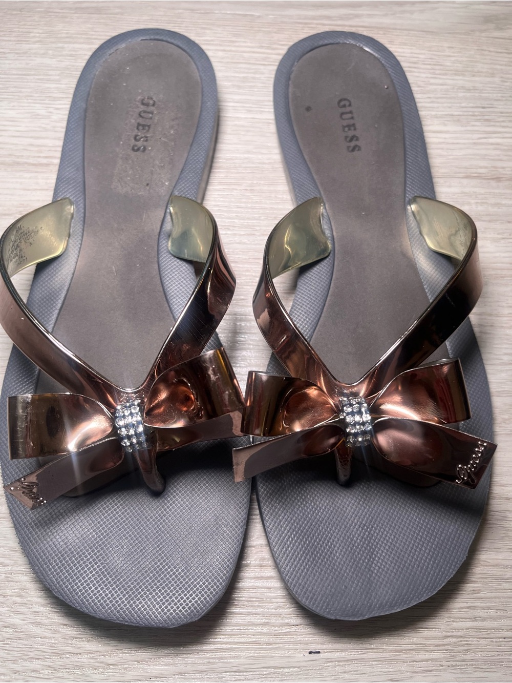 GUESS Rose Gold Bow Jelly Sandals with Rhinestone Accent 5.5
